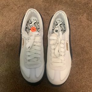 Black and white puma thick sole shoes